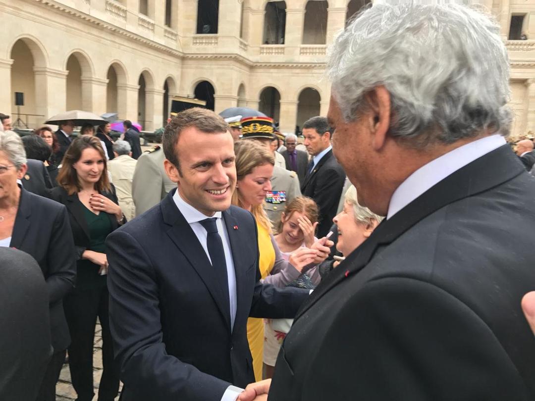 The same day: the President works his way along the rows and shakes Marcel Cohen's hand