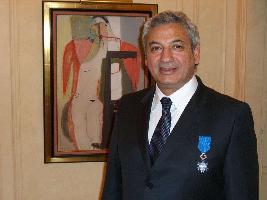 Marcel Cohen wearing the cross of the Ordre National du Mérite on its blue ribbon