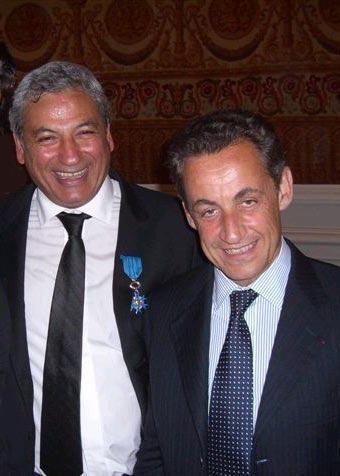 The Ordre National du Mérite ceremony at the ministry of the interior: Marcel Cohen, the blue insignia at his buttonhole, with Nicolas Sarkozy